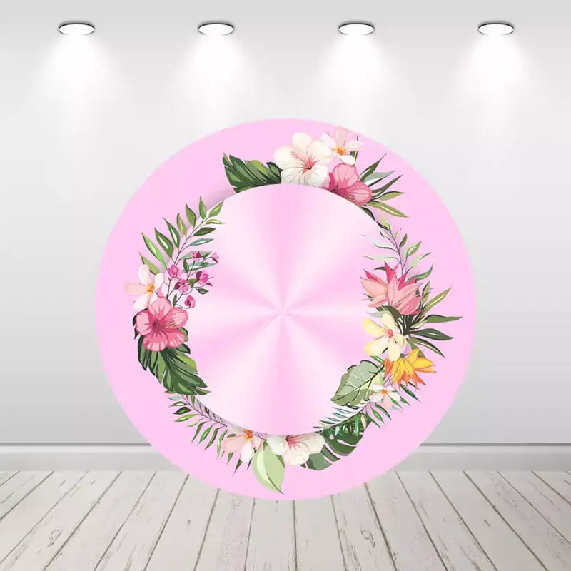 Round pink backdrop with a tropical floral wreath of hibiscus and plumeria flowers, ideal for creating a summery, tropical vibe.