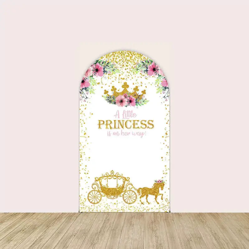 Center arch with gold crown, pink flowers, and the phrase “A little princess is on her way” above a glittering golden carriage.