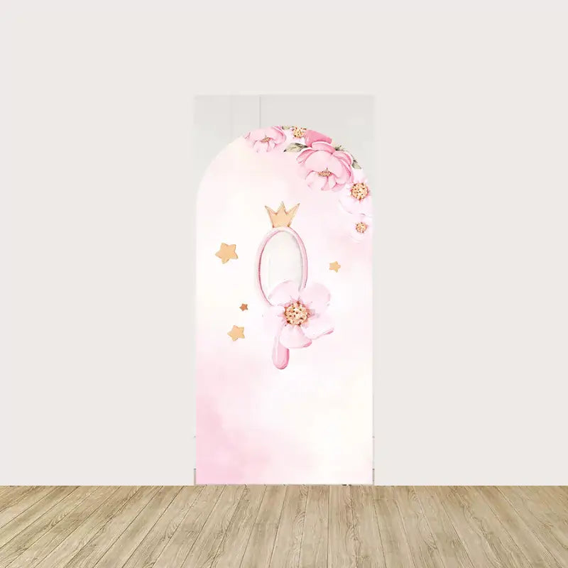 Arch panel featuring a royal hand mirror with gold crown, pink florals, and stars—charming accent for a fairytale baby girl party.
