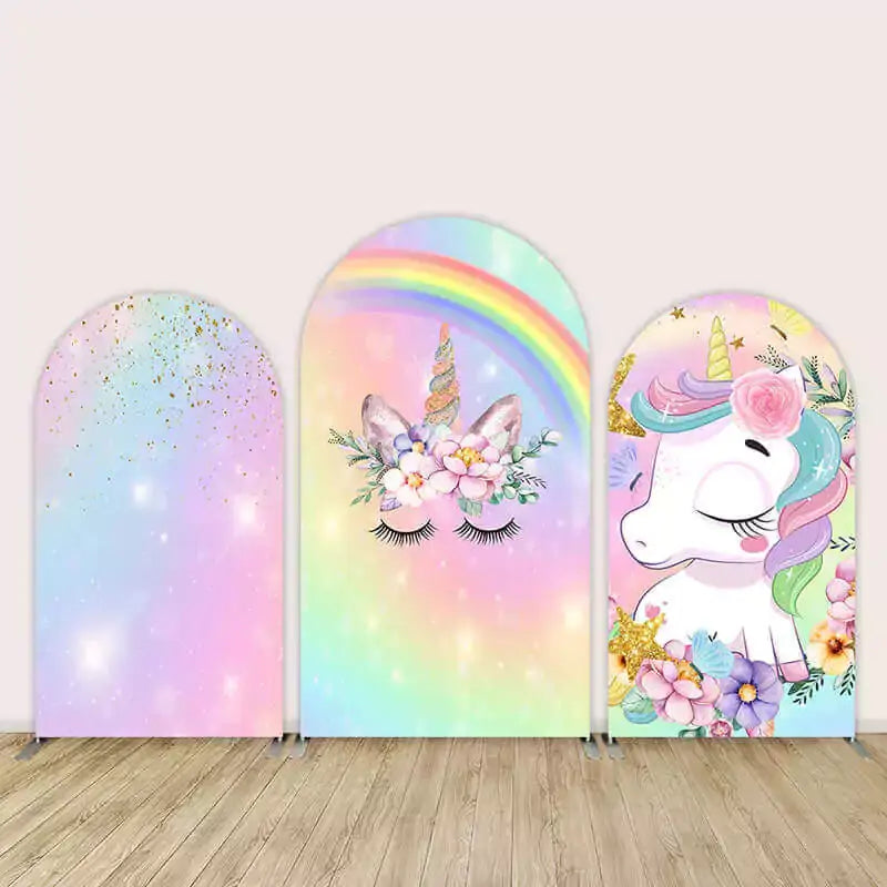 Three-piece arch backdrop set featuring a rainbow unicorn with pastel colors, sparkles, floral crown, and closed eyes design for girls’ party decor.