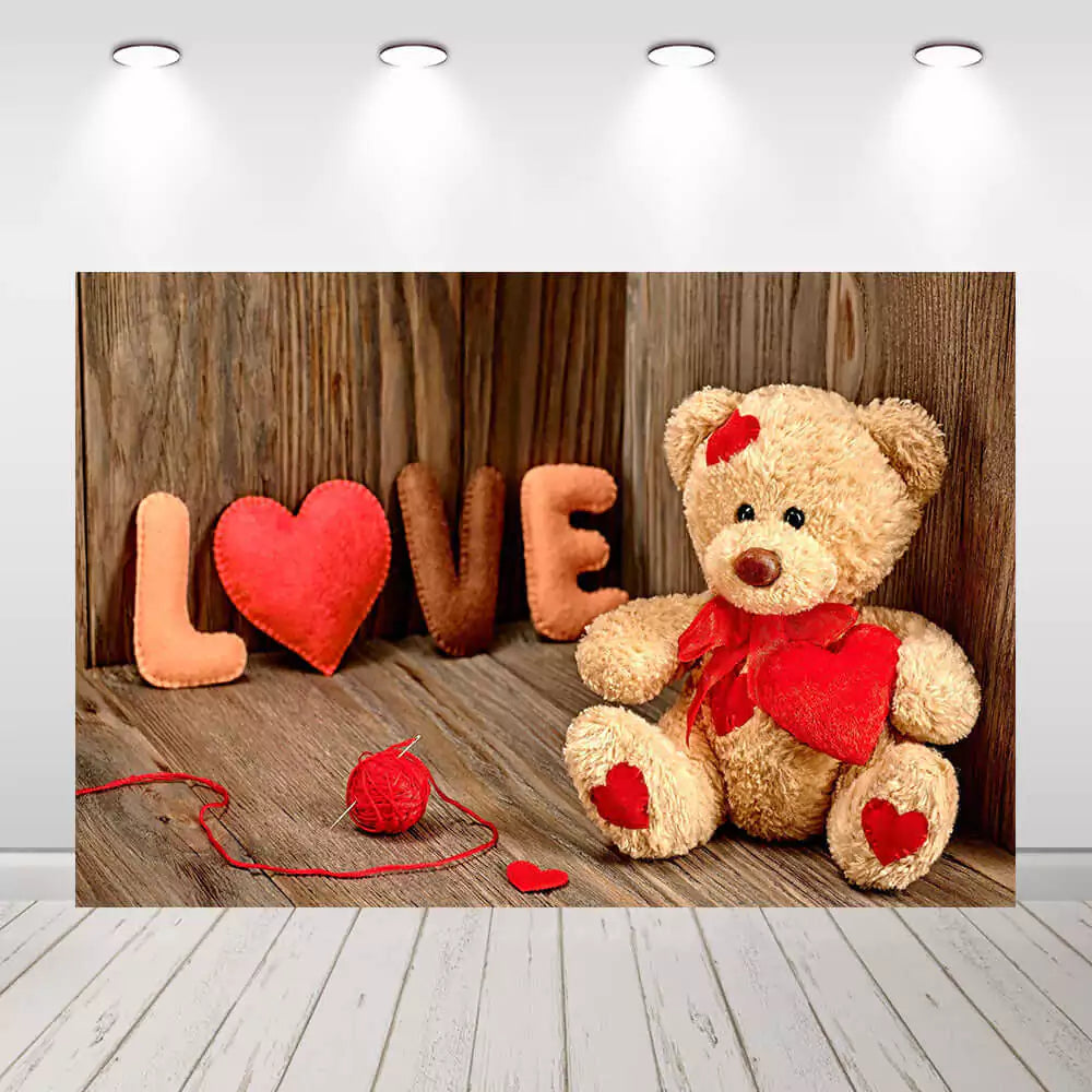 Romantic teddy bear backdrop with felt heart decorations, a wooden wall, and a red yarn ball – ideal for Valentine’s Day or love-themed parties