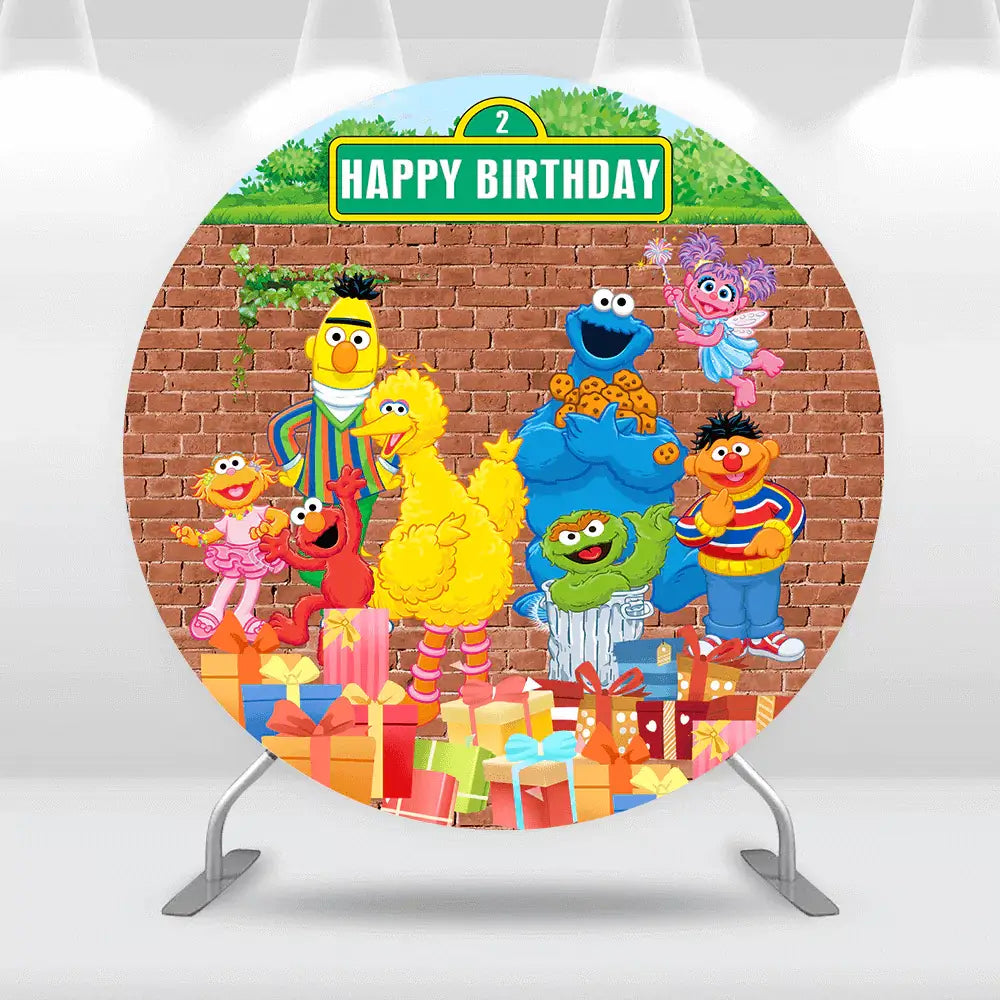 Colorful Sesame Street birthday backdrop with Elmo, Big Bird, Cookie Monster, and friends in front of a brick wall, surrounded by presents and a 'Happy Birthday' sign with the number 2.