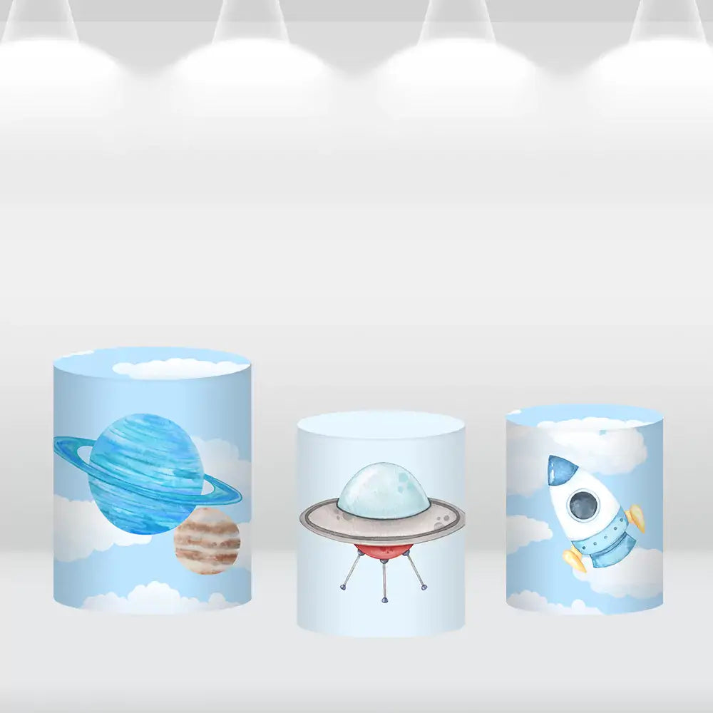 Set of three space-themed cylinder covers featuring Saturn with other planets, a UFO, and a rocket ship design, complementing the astronaut backdrop.