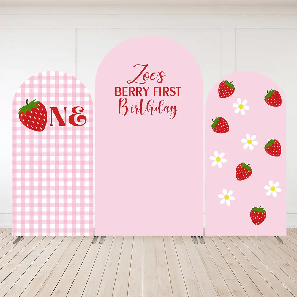 Three-panel strawberry-themed birthday backdrop with “Berry First Birthday” text, pink gingham pattern, strawberries, and daisy flowers.