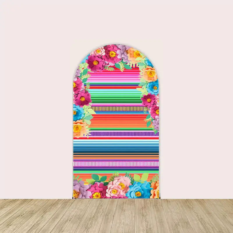 Center arch with bold serape-style stripes framed by colorful floral clusters at top and bottom—ideal for fiesta party centerpiece backdrop.