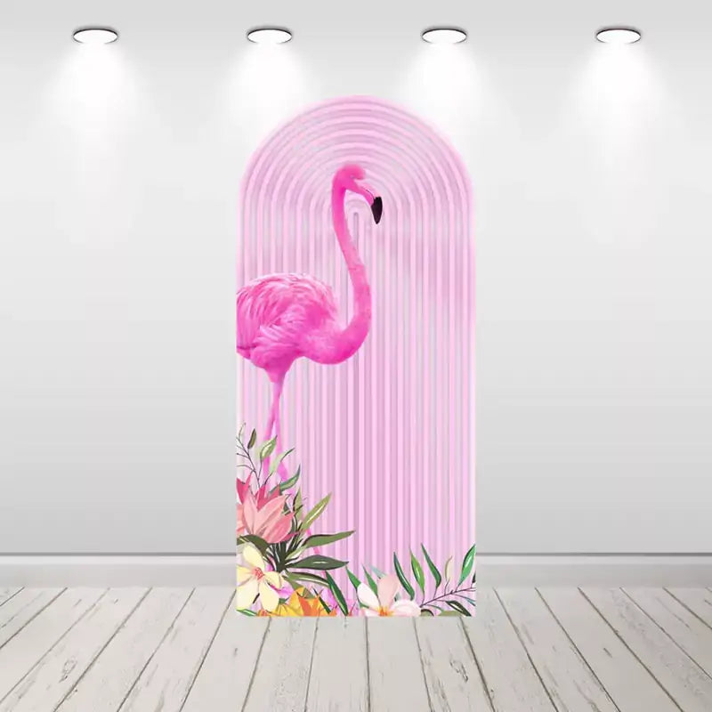 Arched pink backdrop with a large flamingo and floral accents at the bottom, perfect for a Hawaiian or beach-themed party.