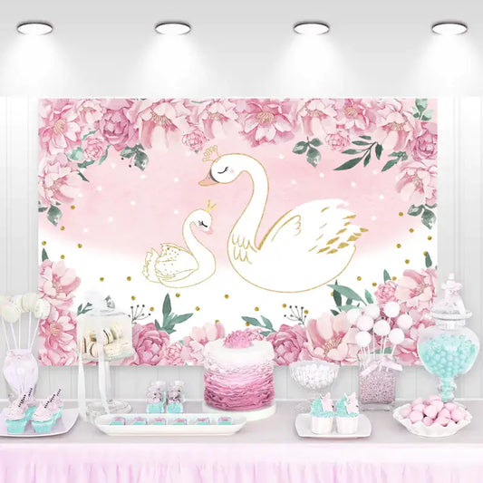 Elegant swan mother and baby party backdrop with pink floral border and pastel decorations.