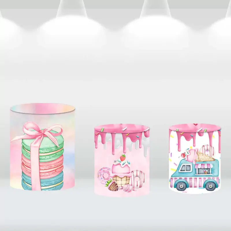 Three dessert-themed backdrop cylinder covers featuring macarons, donuts, and ice cream truck designs
