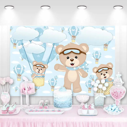 Teddy bear birthday backdrop with blue hot air balloons, clouds, and flying aviator bears – perfect for a baby boy's birthday party or baby shower.