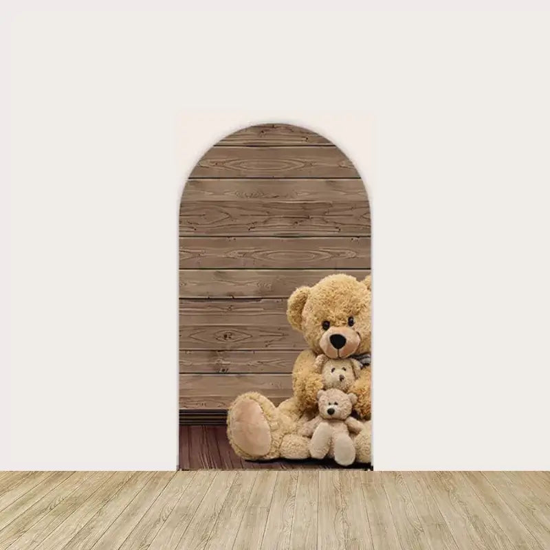 Left arch panel featuring a family of plush teddy bears sitting in front of a rustic wooden background—perfect for a cozy baby shower scene.