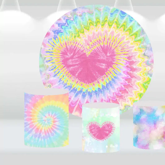 Tie-dye heart-themed round backdrop with rainbow colors and three matching cylindrical pedestal covers featuring tie-dye and heart designs.