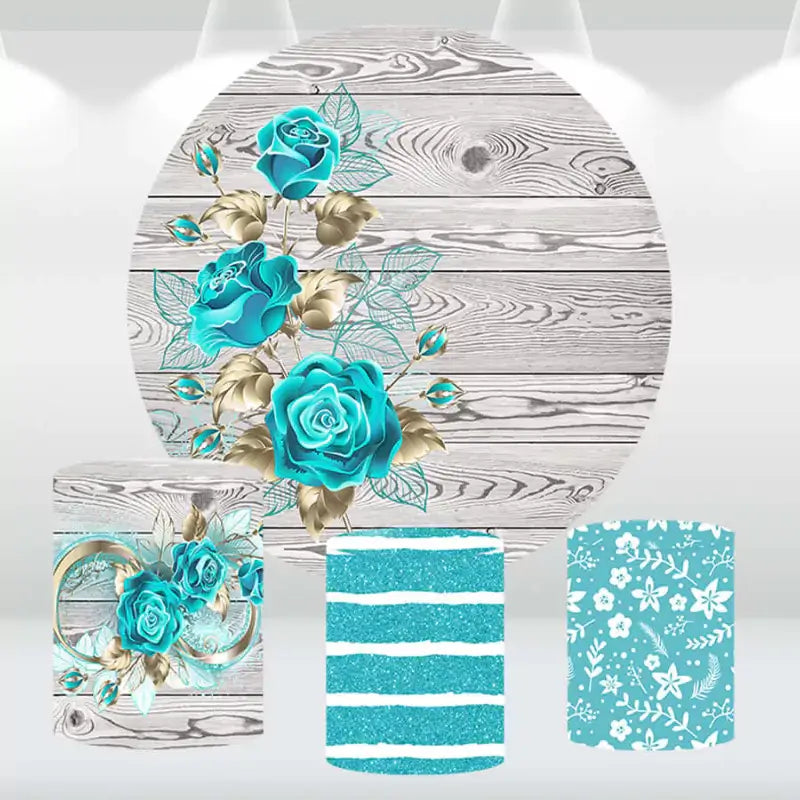Turquoise rose and gold-themed round backdrop with three matching cylindrical pedestal covers featuring floral, glitter, and wood grain designs.
