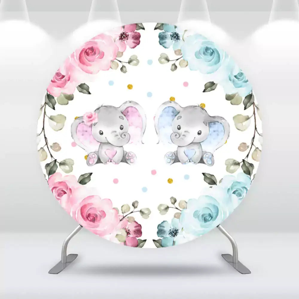 Round baby shower backdrop with two cute baby elephants, one with pink accents and one with blue, surrounded by floral borders in pink and blue tones on a white background with polka dots.