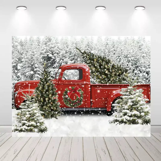 Vintage red truck Christmas backdrop with a snowy forest background, pine trees, holiday wreath, and tree in the truck bed – perfect for festive photo shoots