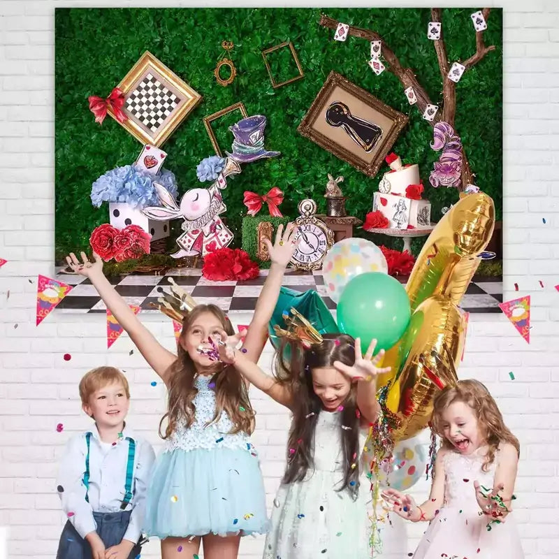 Fantasy party backdrop with Alice in Wonderland theme – tea cups, keyhole frame, oversized clock, playing cards, and enchanted greenery