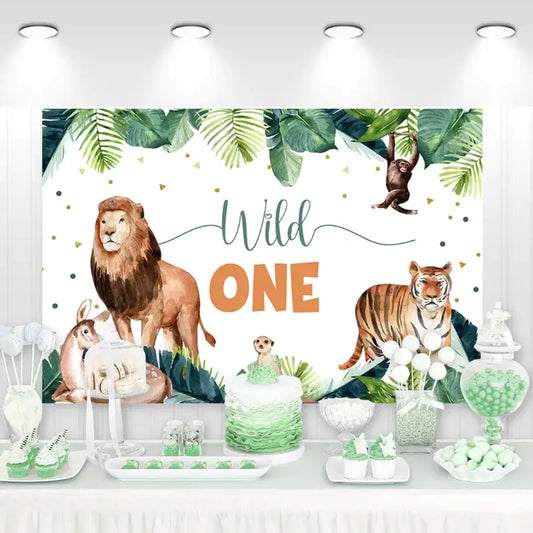 Wild One birthday backdrop featuring jungle animals like lion, tiger, kangaroo, and monkey with tropical leaves – perfect for a safari-themed first birthday party.