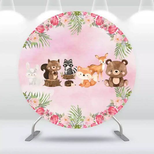 Woodland animals birthday backdrop with pink watercolor background and floral border.