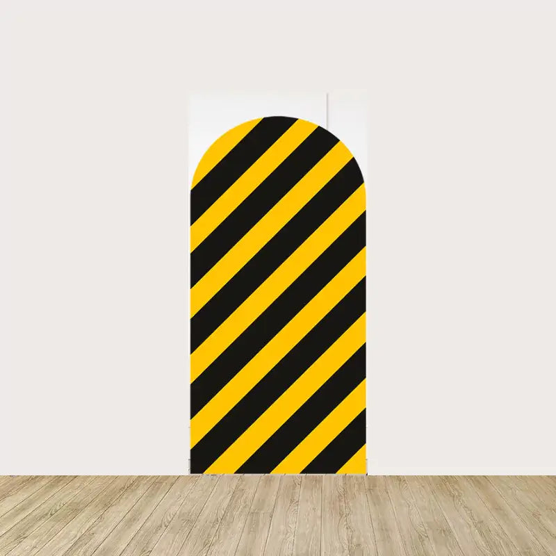 Arch panel with bold yellow and black diagonal caution stripes—great for builder-themed birthday parties or construction event decor.