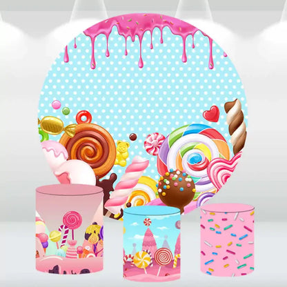 Candy Land-themed backdrop set with lollipops, candy swirls, and sprinkle-covered cylinder covers