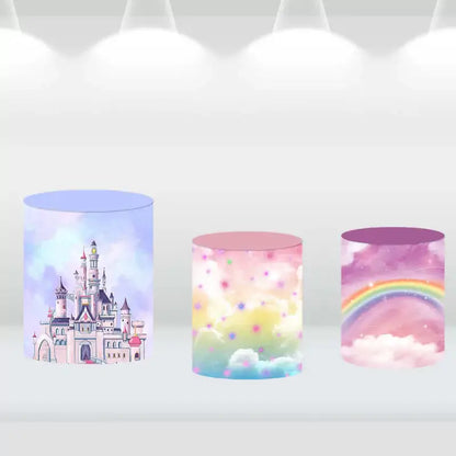 Cylinder covers designed with a watercolor castle, dreamy clouds, and a vibrant rainbow, complementing the magical castle backdrop.