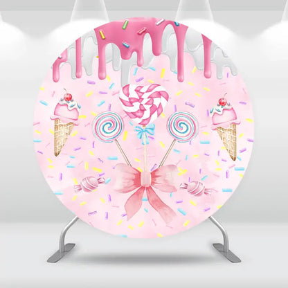 Round candy-themed backdrop with dripping pink icing, lollipops, ice cream cones, and sprinkles, ideal for sweet-themed parties