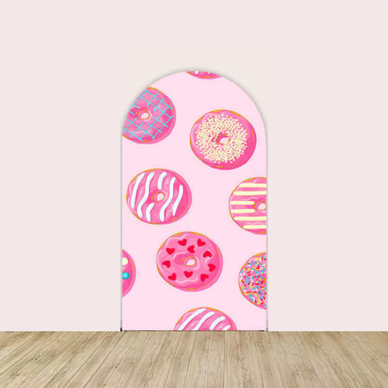 Right arch backdrop with a pink background featuring colorful donut illustrations decorated with frosting and sprinkles.