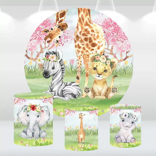 Safari-themed baby shower backdrop featuring a giraffe, zebra, lion cub, and matching cylinder covers with elephant, giraffe, and hippo designs.