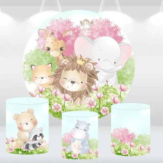 Woodland-themed party decor set with a round animal backdrop and matching cylinder covers, featuring a lion, elephant, and giraffe in a floral setting.