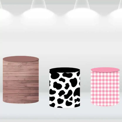 Farm-themed cylinder covers in wood, cow print, and gingham designs