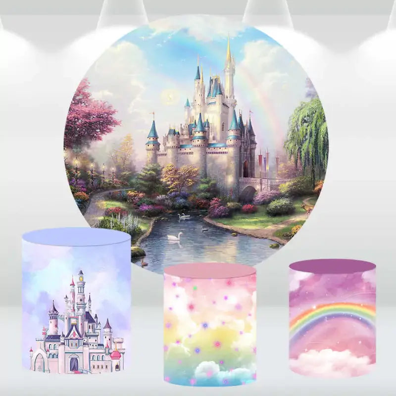 Castle-themed party backdrop with a magical landscape, rainbow, and matching cylinder covers featuring a castle, clouds, and rainbow.