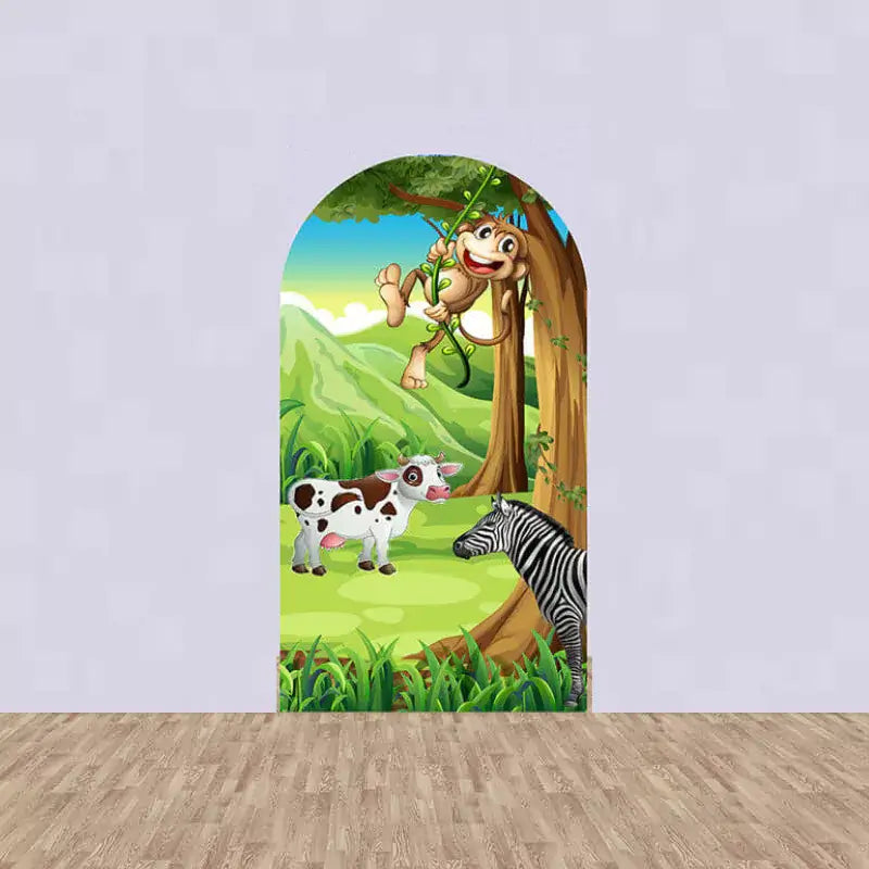 Arch backdrop with a swinging monkey, a cow, and a zebra in a lush green jungle setting.