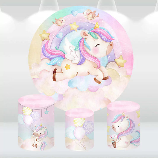 Pastel-colored unicorn party decor set with a whimsical backdrop and cylinder covers, perfect for children's birthdays and celebrations.