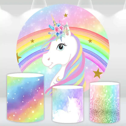 Magical unicorn party backdrop set with a rainbow and glitter design, including three matching cylinder covers for a fantasy-themed celebration.