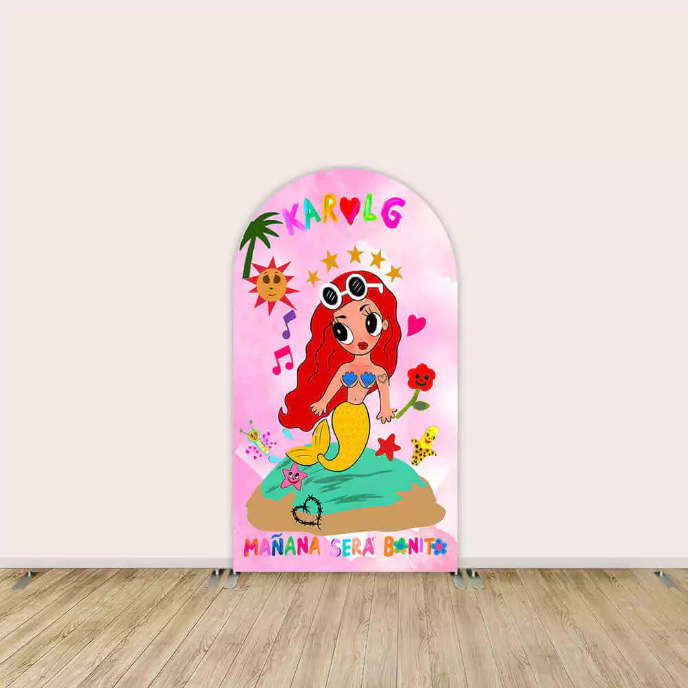 Center arch backdrop featuring a mermaid on an island with 'Mañana Será Bonito' text, music notes, and vibrant decorations.