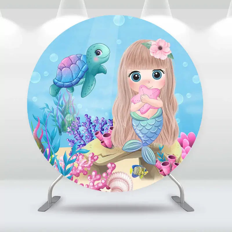 Round underwater-themed backdrop with a cute mermaid holding a starfish, surrounded by sea life and coral.