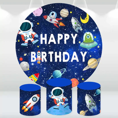 Space-themed birthday backdrop set featuring astronauts, rockets, and planets with matching cylinder covers.