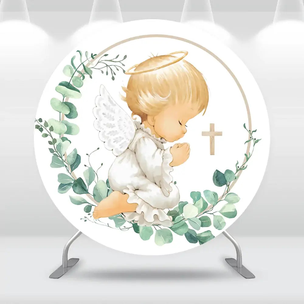 Praying angel backdrop with green leaves and a gold cross for christening decor.