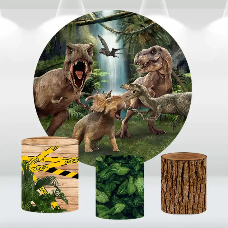 Dinosaur-themed party backdrop with realistic jungle scene and matching cylinder covers featuring caution tape, leaves, and a tree trunk design.