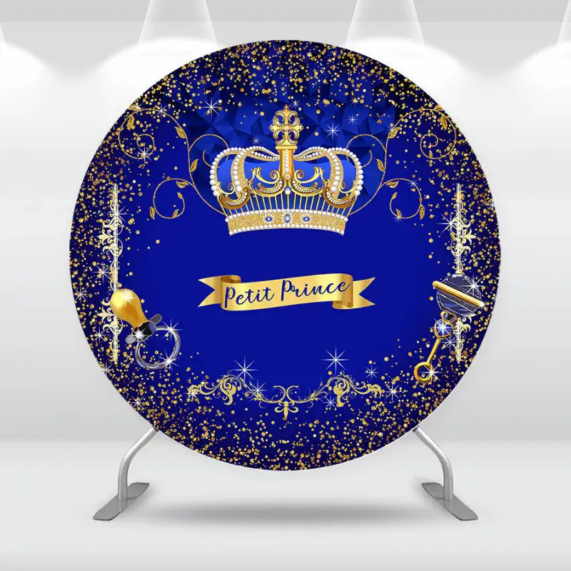 Luxurious 'Petit Prince' baby shower backdrop featuring a royal blue background with a gold crown and intricate golden accents.