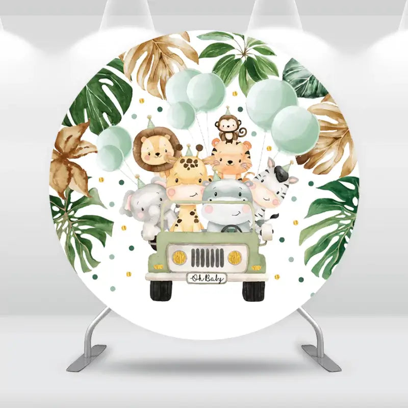 Round safari baby shower backdrop featuring jungle animals in a jeep surrounded by tropical leaves and balloons.