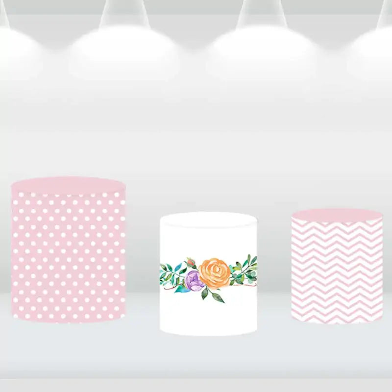 Cylinder covers featuring pink polka dot, floral design, and pink chevron patterns for baby showers