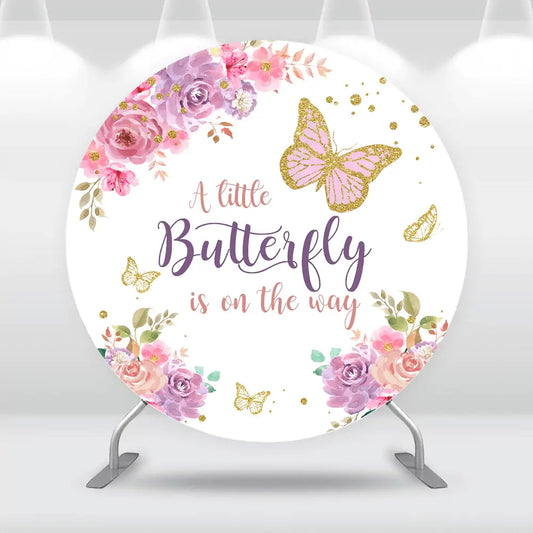 Floral butterfly baby shower backdrop with pink and purple flowers and glitter butterflies.