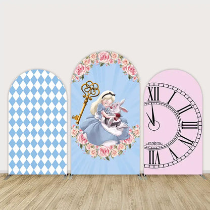 Three-panel Alice in Wonderland-themed arch backdrop set featuring Alice with the White Rabbit, pink clock face, blue diamonds, and floral elements.