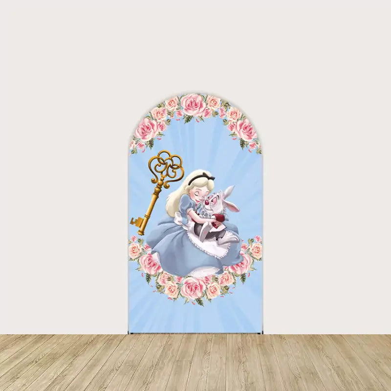 Center arch panel with Alice hugging the White Rabbit, surrounded by pink roses and a golden key on a blue sunburst background.
