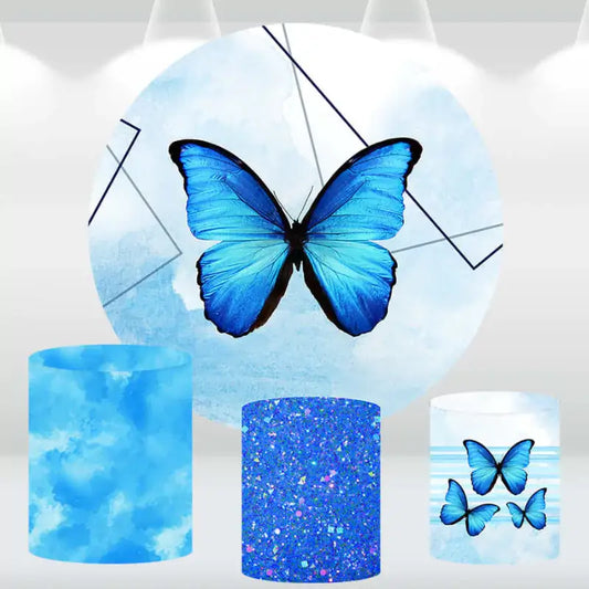 Round backdrop featuring a large blue butterfly with three cylindrical pedestal covers in various blue and butterfly designs.