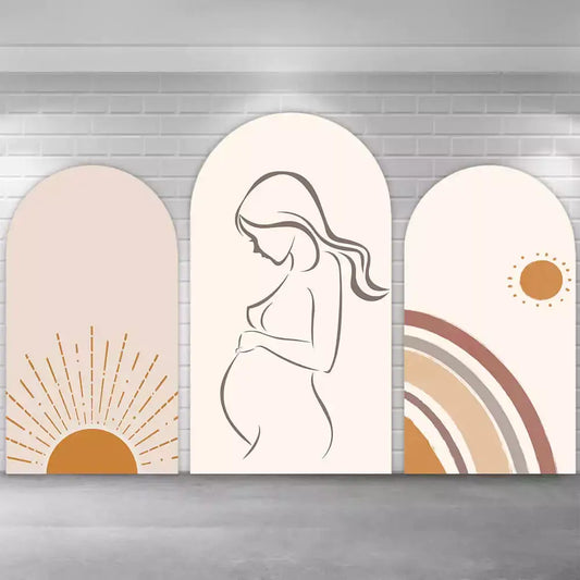 Three-panel boho baby shower backdrop featuring a minimalist pregnant woman silhouette, a sunburst design, and a warm-toned rainbow with sun icon.