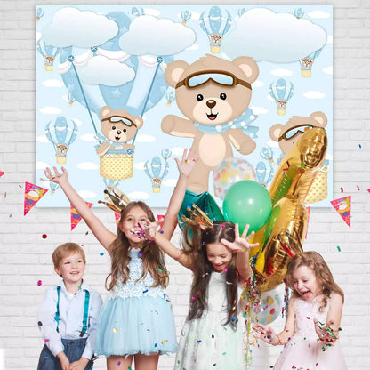 Cute aviator teddy bear backdrop featuring hot air balloons, fluffy clouds, and pastel blue sky – ideal for little boys’ birthday celebrations.