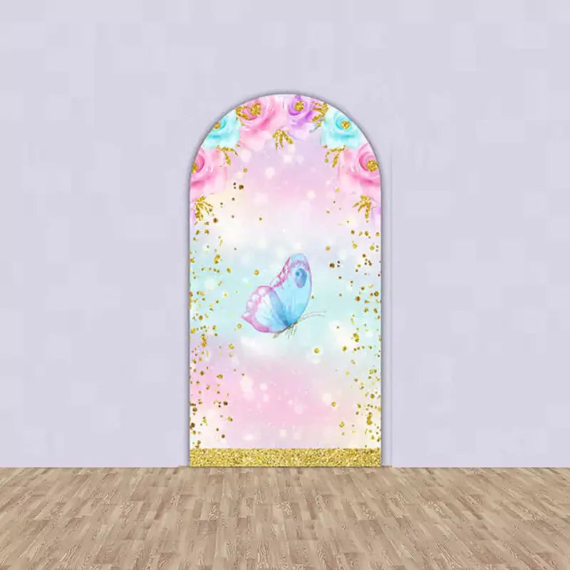 Pastel-themed butterfly arch backdrop featuring a blue butterfly with floral and glitter accents, perfect for birthday parties.