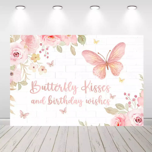 Butterfly-themed birthday backdrop with pink flowers and "Butterfly Kisses and Birthday Wishes" text, perfect for kids' birthday parties.