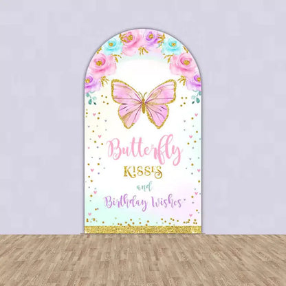 Tall central arch backdrop with a pink butterfly, floral designs, and the text 'Butterfly Kisses and Birthday Wishes,' ideal for birthday celebrations.